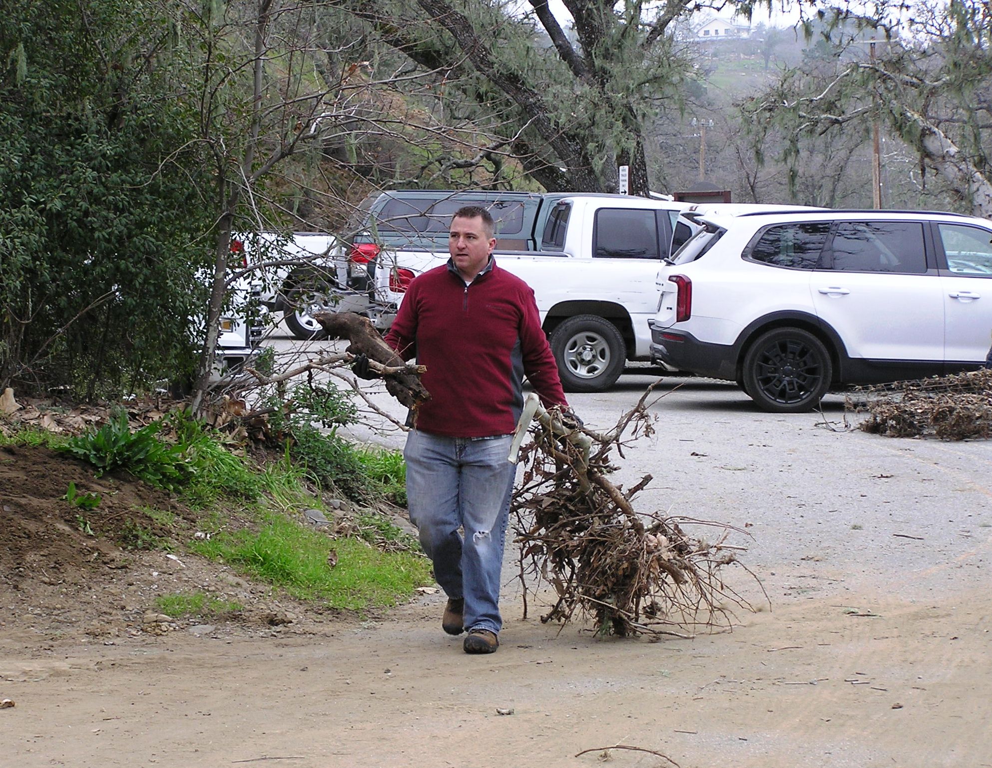 Dragging debris to the dumpster.